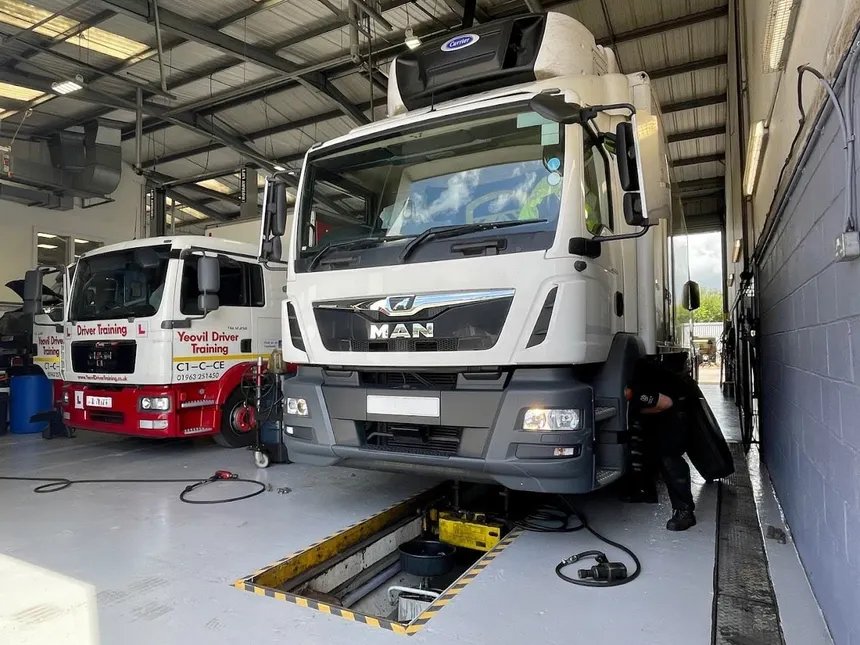MAN truck undergoing HGV annual test inspection at a DVSA approved test station UK